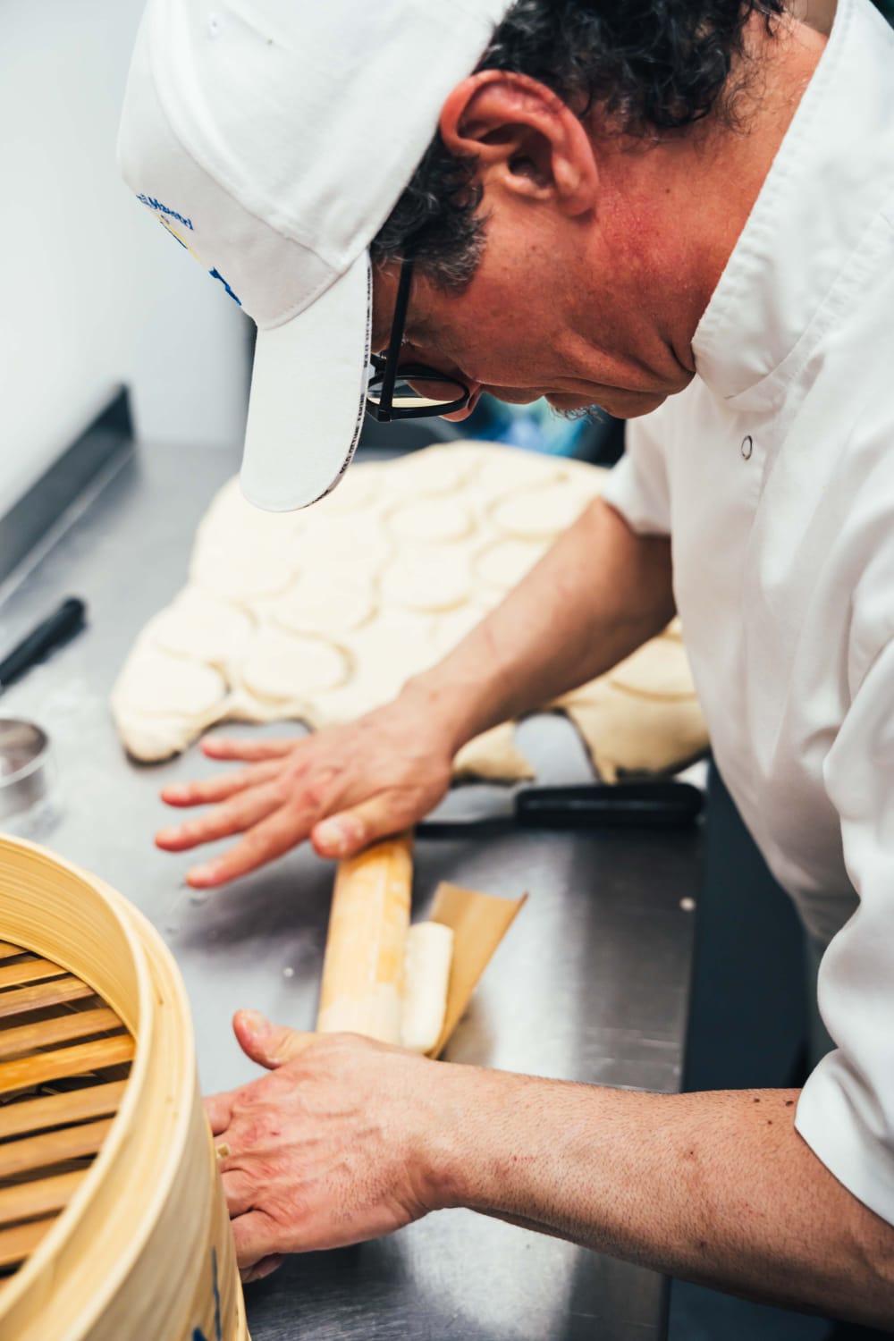 Chef Aldo preparing bao dough by hand